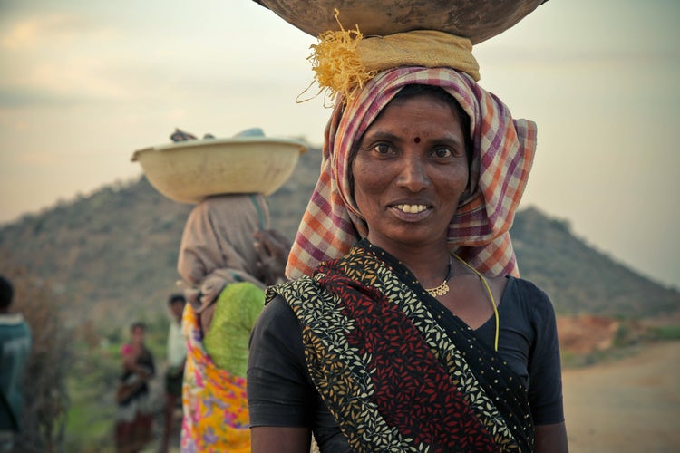 Woman working basket on head Ron Hansen