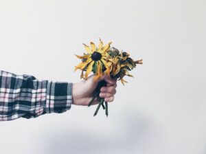 hands giving flowes