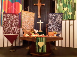 All Saints Day banners and fall decor in worship space