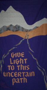 Advent banner that says Give light to this uncertain journey