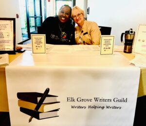 Betsy and Samone registrars at 9/2023 Elk Grove Writers Guild Writers' Conference