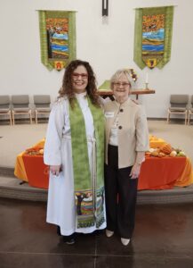 Betsy with St. Augustine Church's priest, Rev. Anny Genato 2023
