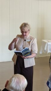 Betsy reading Peter's story at 2024 book launches
